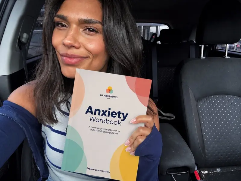 Jade holding the Anxiety Workbook